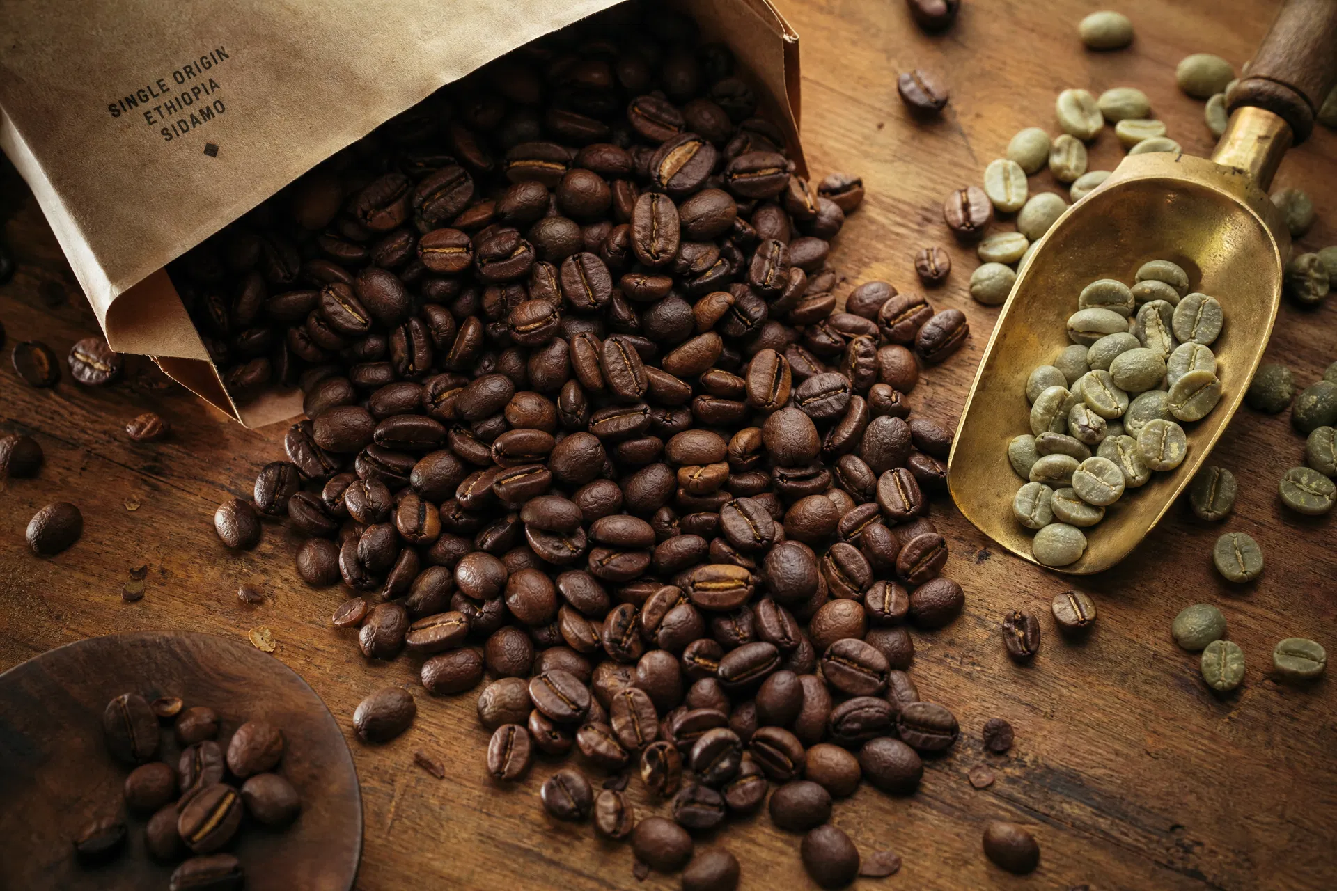 Freshly roasted beans spilling from a kraft bag